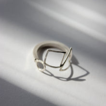 Square band open shapes ring
